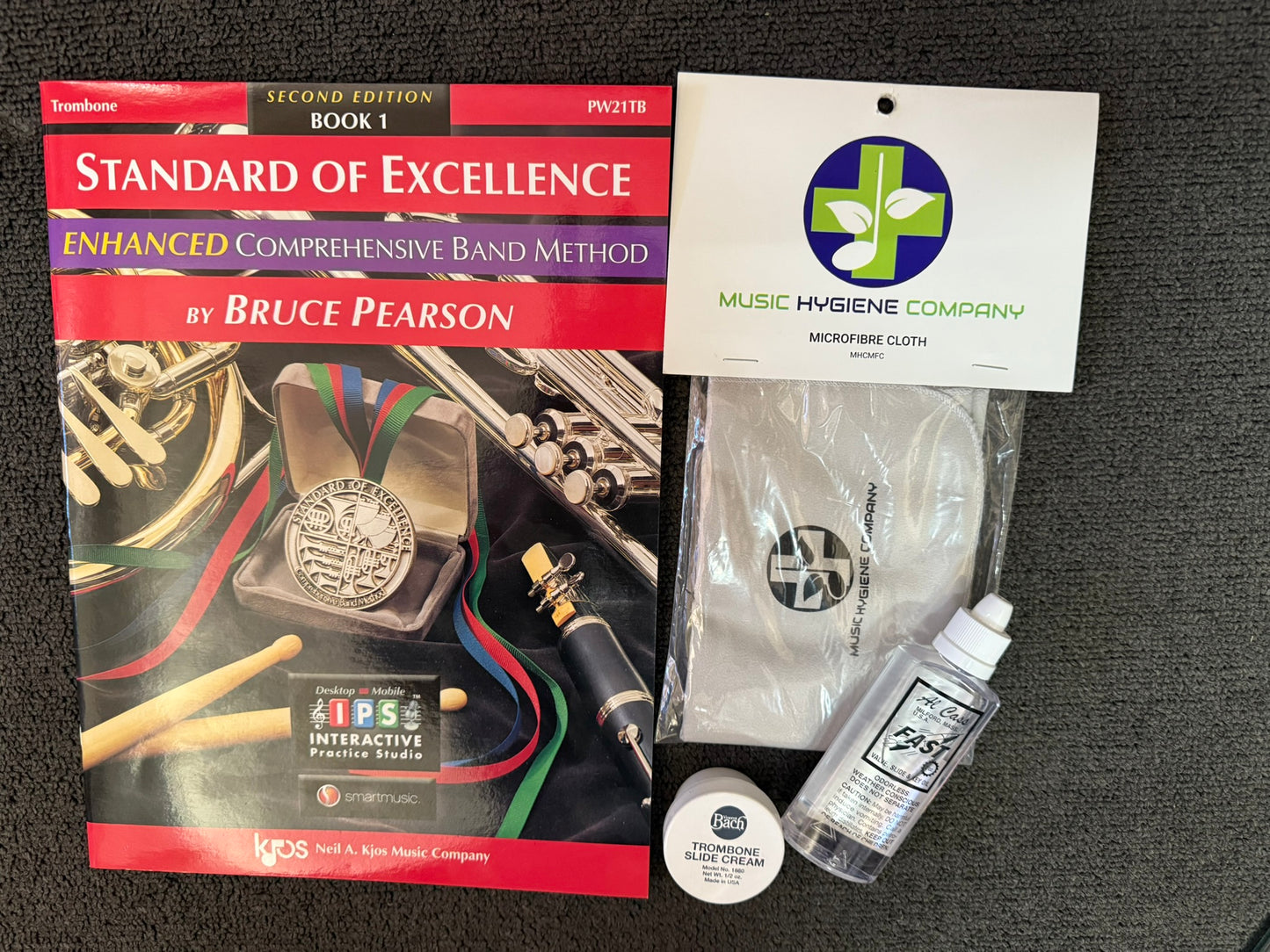 Trombone Standard of Excellence book with music hygiene accessories.