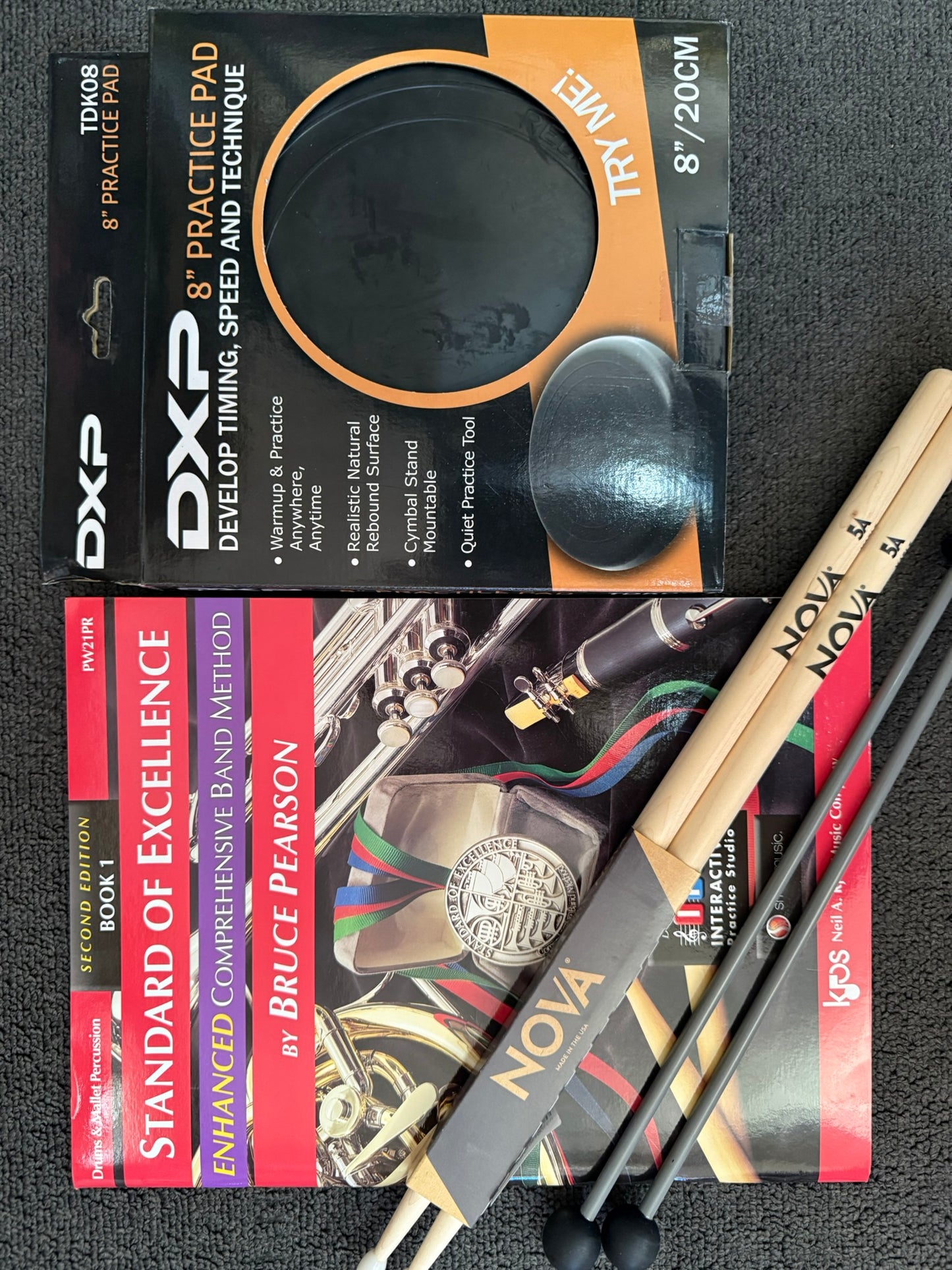 Musicians Oasis Percussion Deluxe Student Bundle with drumsticks, mallets, practice pad, and book.